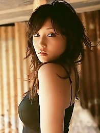 Captivating asian babe looks incredible in her black bikini