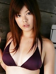 Busty asian babe with perfectly rounded tits in a purple bikini