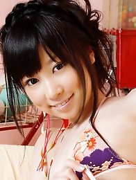 Beautiful pale skin asian goddess poses in her mint green bikini