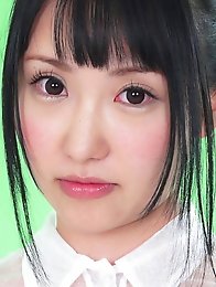 On the green screen Reina ran her hands across her see through outfit