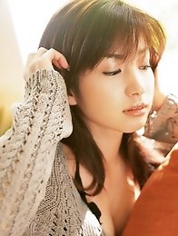 Enchanting asian chick Junko Yaginuma tempts at the beach with her soft boobs