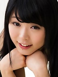 Brunette slender beautiful Japanese teen Yui Kawagoe takes off her black panties