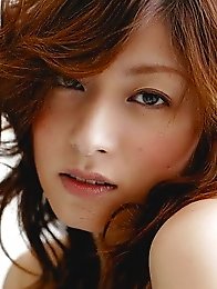 Red-haired Japanese girl Karen Kisaragi in white panties fondles her hairy pussy