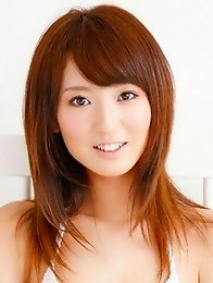 Spunky gravure idol jumping up and down as a cheerleader