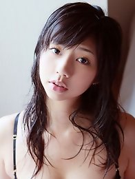 Beautiful gravure idol with milky white skin in silky lingerie