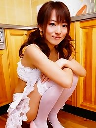 Sexy gravure idol babe in a short white lace skirt and stockings