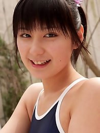Miu Nakamura Asian in bath suit plays with water in her garden