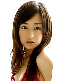 Sexy asian model shows off her arousing curves in a bikini