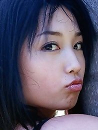 Yoko Mitsuya busty Asian posing outside in her black bikini