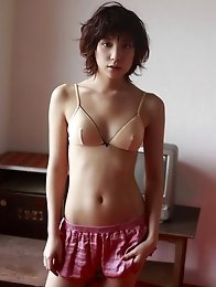 Miu Nakamura shows off her tiny tits in a pink bra and panties