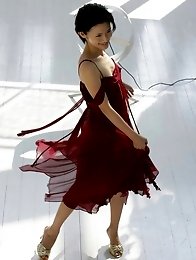 Mari Hoshino is a sexy glamour model posing in her minidress