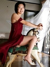 Mari Hoshino is a sexy glamour model posing in her minidress