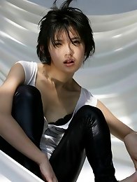 Mari Hoshino is a sexy glamour model posing in her minidress