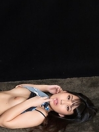 Leggy brunette Kotomi Shinosaki sucking on her finger while showing those legs