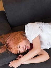 Chie Kobayashi laying on a beautiful bed while brazenly showing her legs/feet