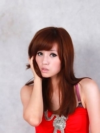 Sandy on heels shows hot behind in red dress for pictures