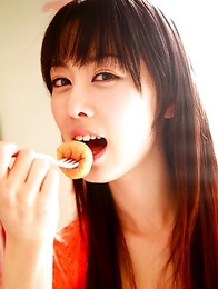 Rina Akiyama Asian in long colorful socks enjoys some sweets