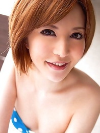 Yuria Satomi spreads legs and shows slit in bikini in bed