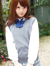 Manami Sato in short uniform skirt spends time in the park