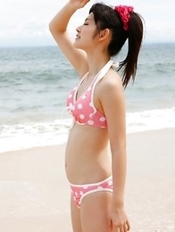 Airi Suzuki in cute bath suit enjoys hot sand on her curves