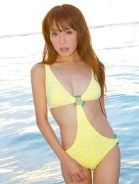 Nozomi Kawasaki in yellow bath suit enjoys the sun and sea