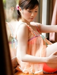 Yuuri Morishita in fluffy lingerie plays with her sexy legs